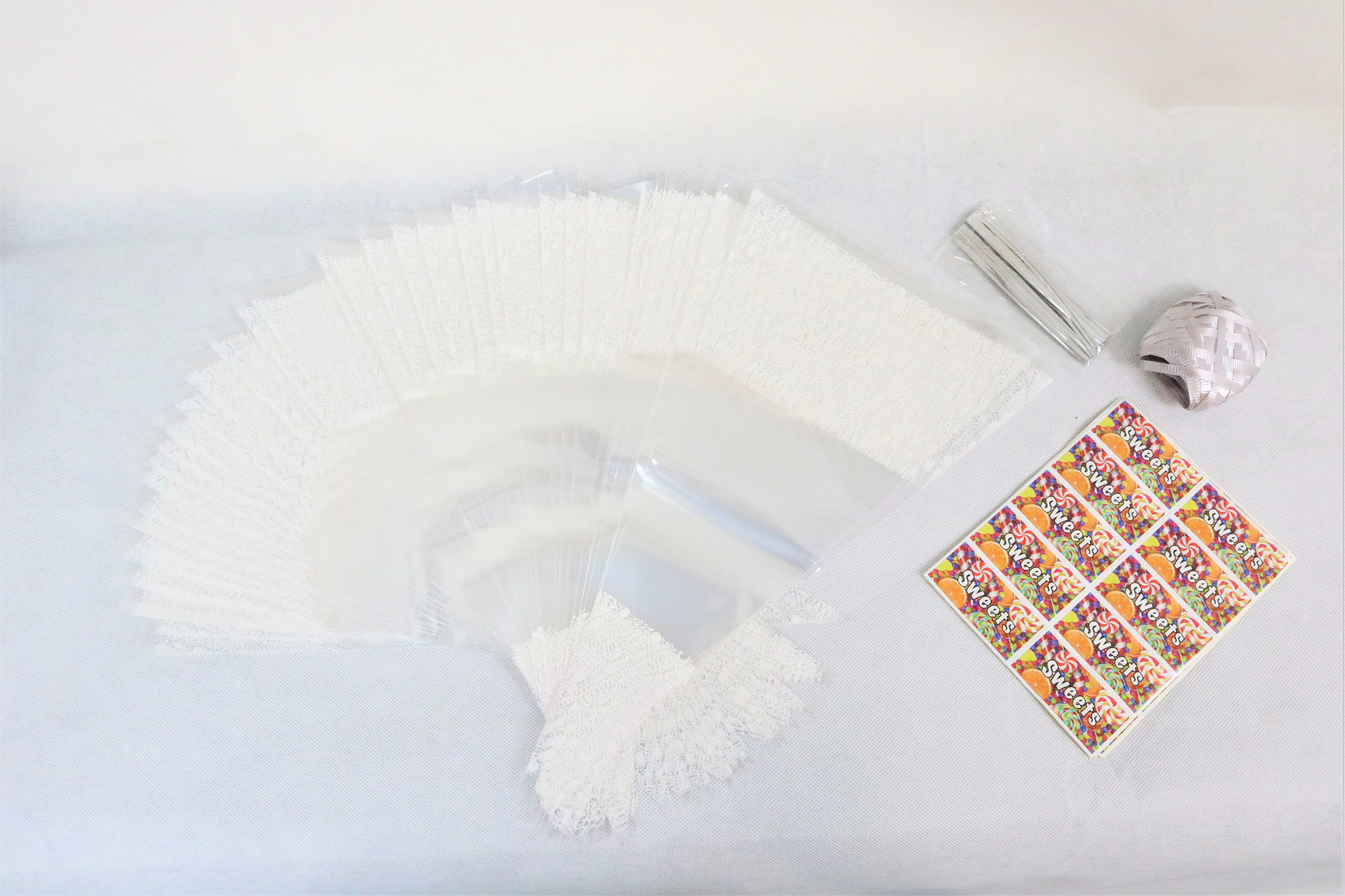 100 x White Decorated Cone Bags With Ribbon Ties & Stickers